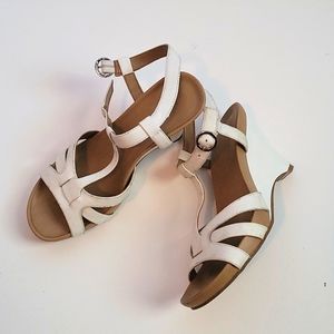 Size 6.5 White sandal with wedge heel.